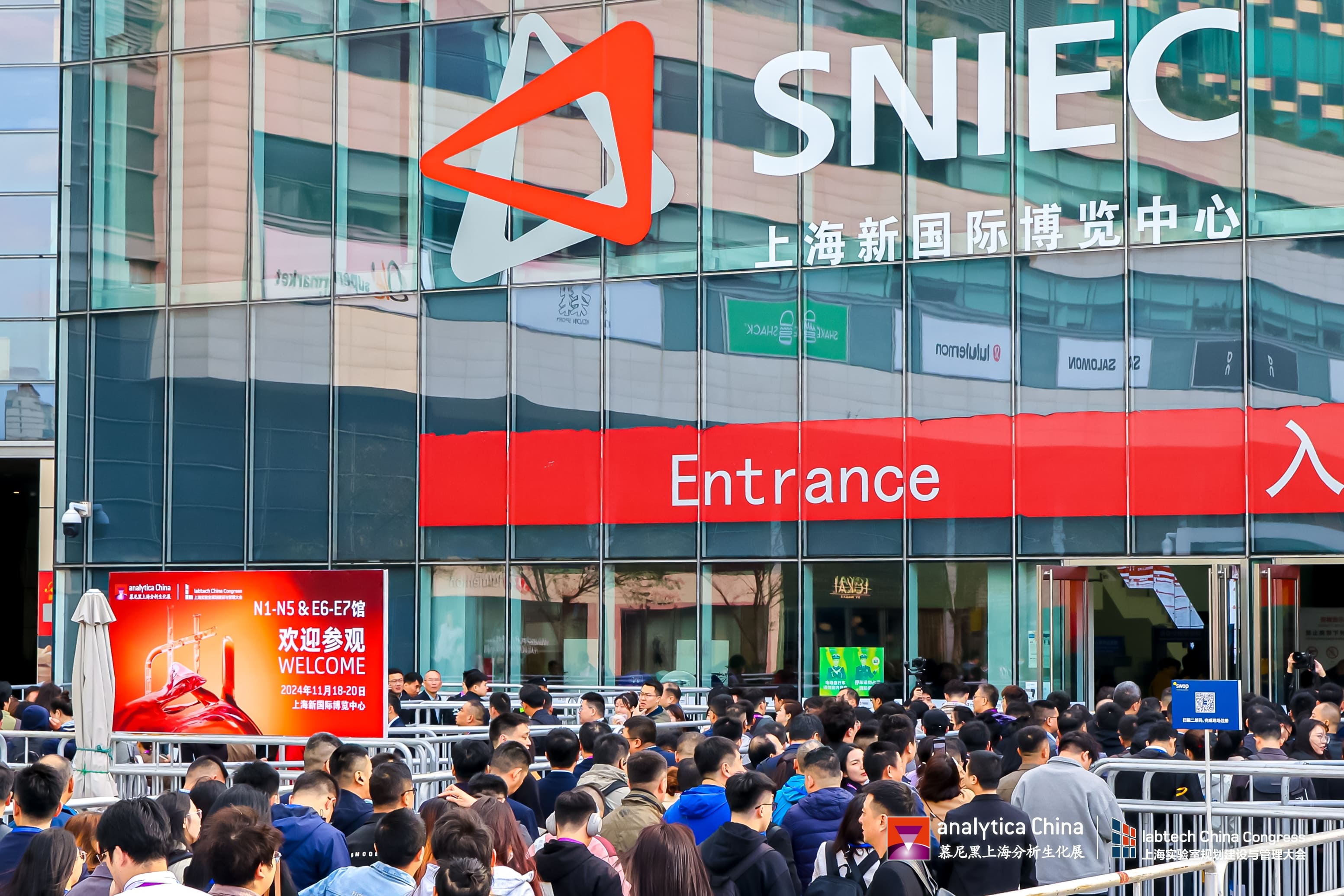 Busy exhibition hall at analytica China 2024 with attendees exploring lab innovations in Shanghai